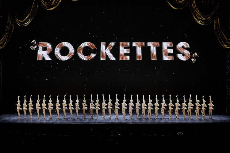 wide shot of The Radio City Rockettes standing in unison